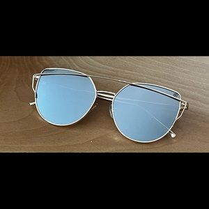 Gold and gray mirrored sunglasses